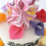 Celebrate Cakes Sugar Flowers - A sugar pink oriental lilies surrounded by brightly coloured calla lilies